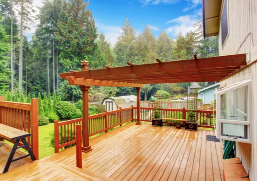 Building the Perfect Deck: A Guide to Selecting the Right Materials, Ensuring Proper Drainage, and Enhancing Ambience with Outdoor Lighting